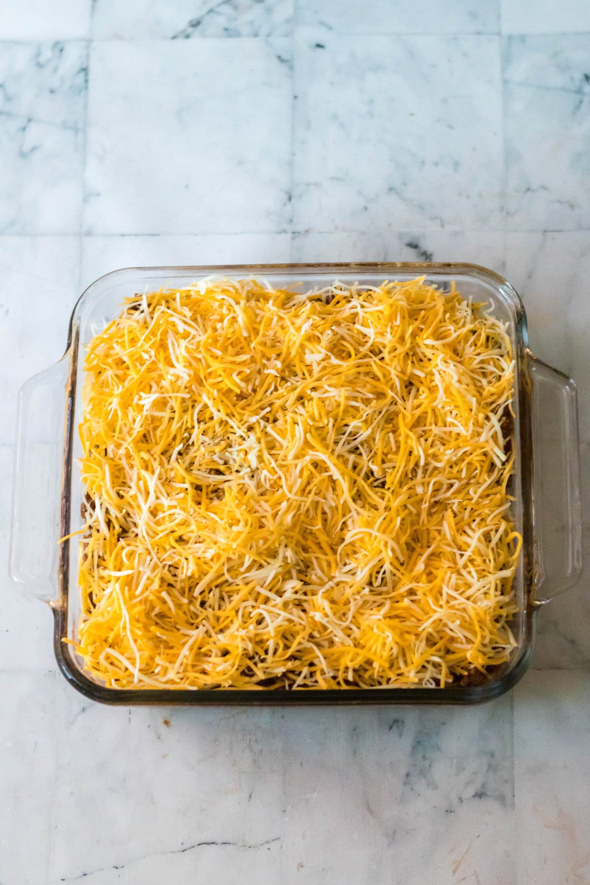 添加一层切碎的奶酪。